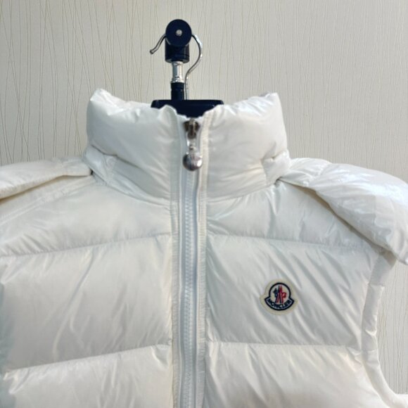 This Moncler white down vest features a mini-puffy design, offering warmth and c - Picture 3 of 8
